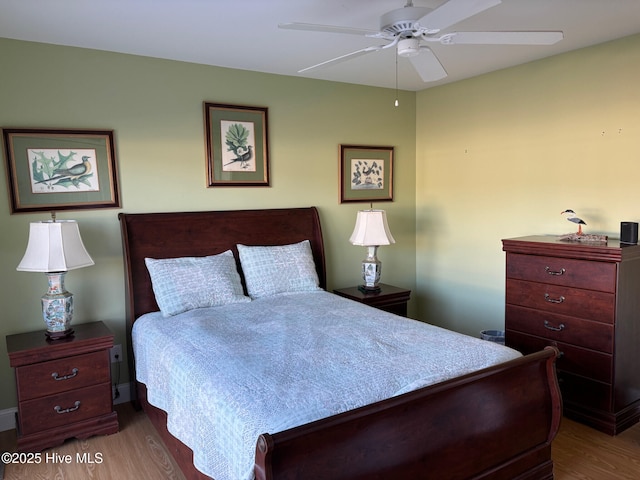 bedroom featuring wood finished floors and a ceiling fan