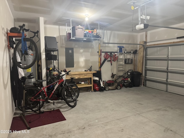 garage featuring electric panel and a garage door opener