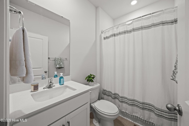 1507 Caracara Dr, New Bern, NC 28560 - full bathroom with toilet, vanity, and recessed lighting