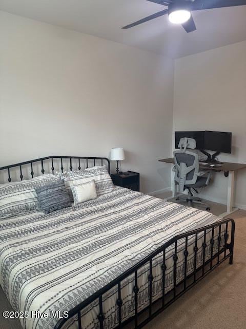 bedroom featuring ceiling fan, carpet floors, and baseboards