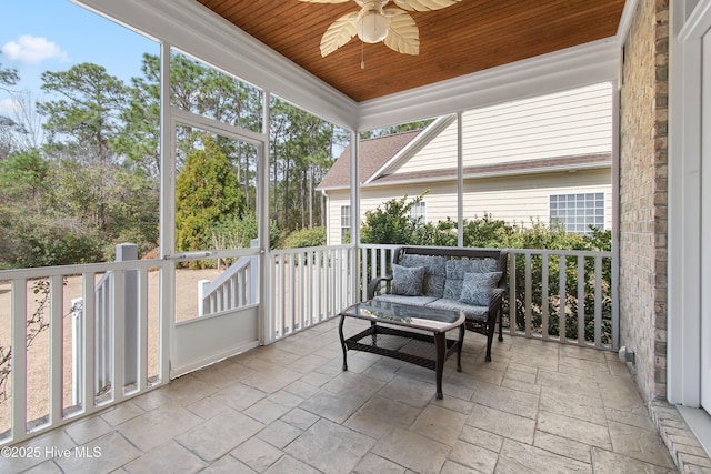 2906 Legends Dr, Southport, NC 28461 - sunroom / solarium featuring a ceiling fan, healthy amount of natural light, and an outdoor living space