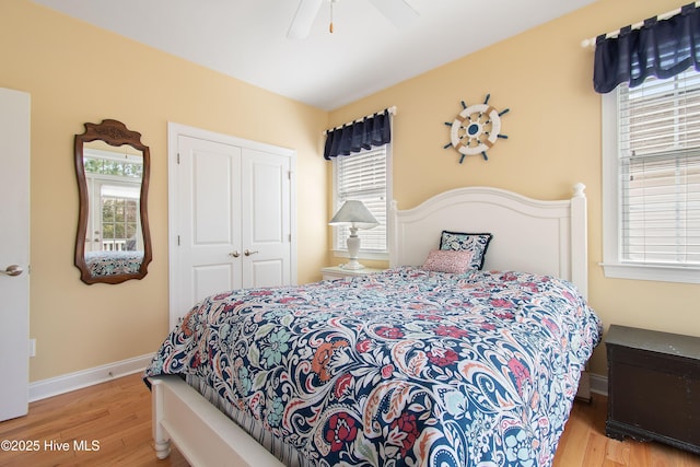 2906 Legends Dr, Southport, NC 28461 - bedroom with a closet, wood finished floors, and ceiling fan