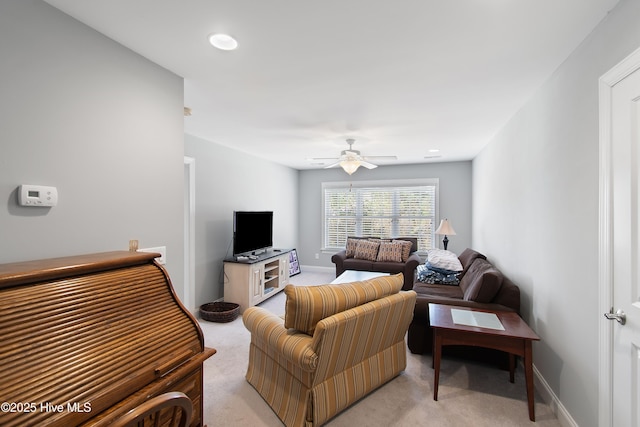 2906 Legends Dr, Southport, NC 28461 - living room with light carpet and a ceiling fan