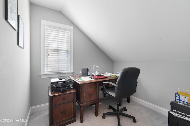 2906 Legends Dr, Southport, NC 28461 - home office with vaulted ceiling, light colored carpet, and healthy amount of natural light