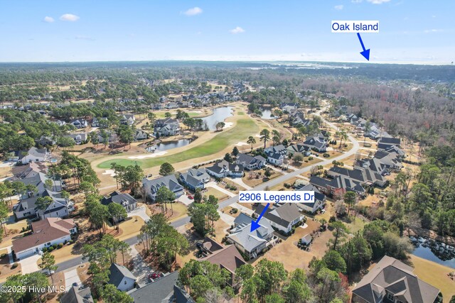 2906 Legends Dr, Southport, NC 28461 - aerial overview of property's location with a golf club, nearby suburban area, and a large body of water