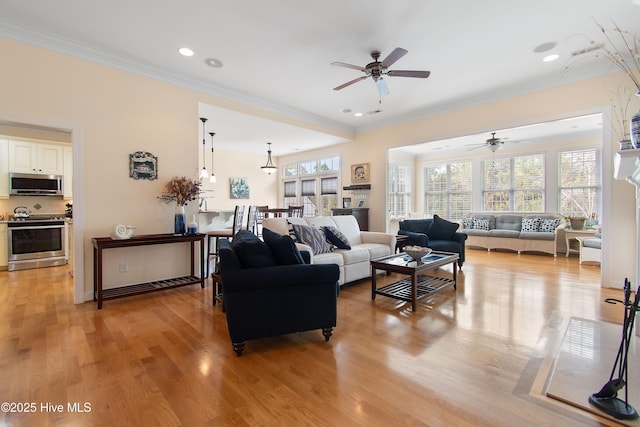 2906 Legends Dr, Southport, NC 28461 - living area with a ceiling fan, crown molding, light wood-type flooring, and recessed lighting