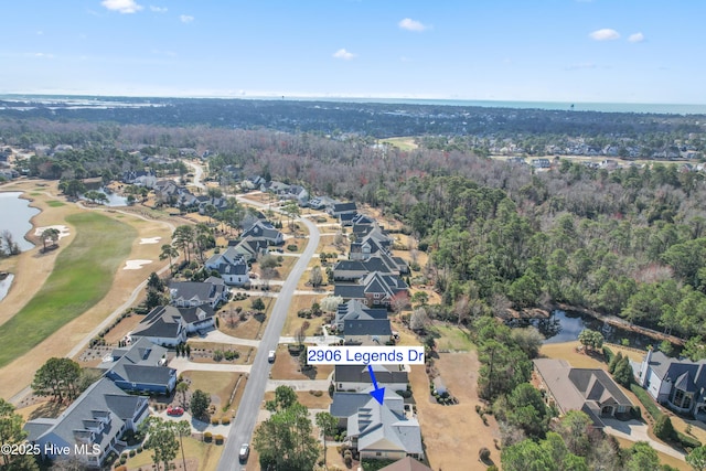 2906 Legends Dr, Southport, NC 28461 - aerial overview of property's location featuring nearby suburban area, a large body of water, and a local golf course