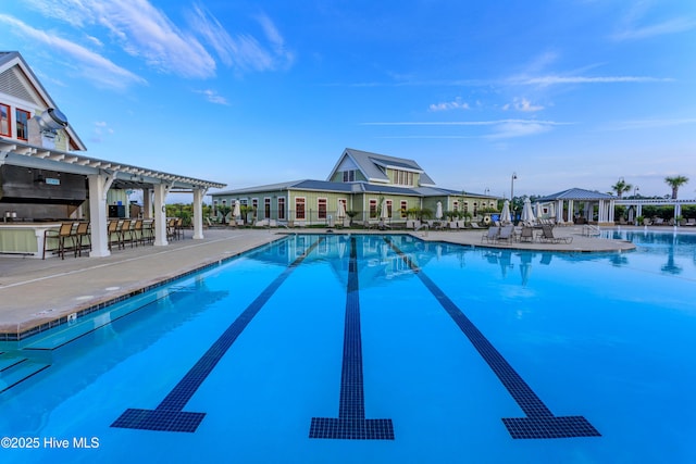 2906 Legends Dr, Southport, NC 28461 - community pool featuring a pergola and a patio