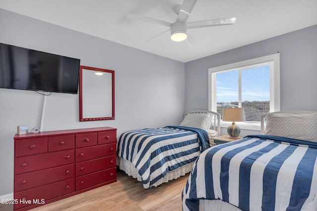 bedroom with wood finished floors and ceiling fan