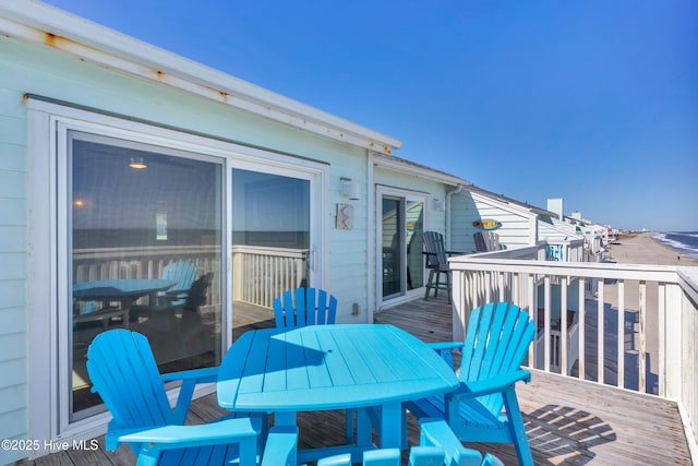 wooden deck with outdoor dining space