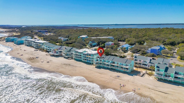 aerial view featuring a water view and a beach view