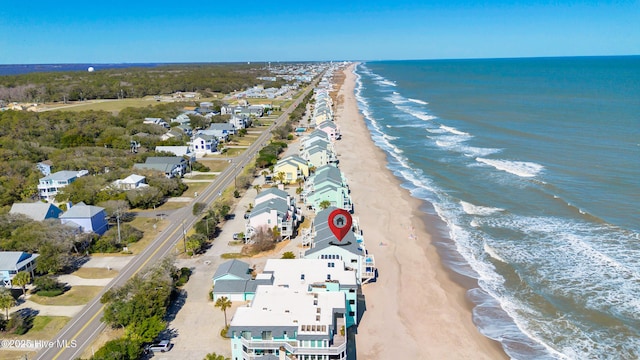 bird's eye view featuring a beach view and a water view