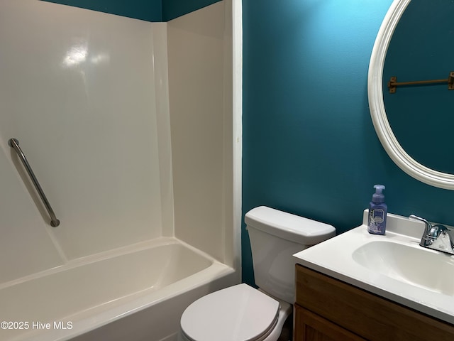 bathroom with vanity, toilet, and shower / washtub combination