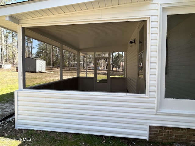 view of patio / terrace with a storage unit and an outdoor structure