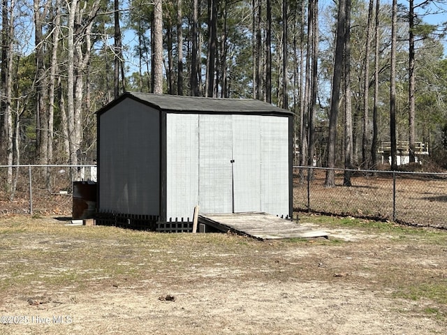 view of shed with fence