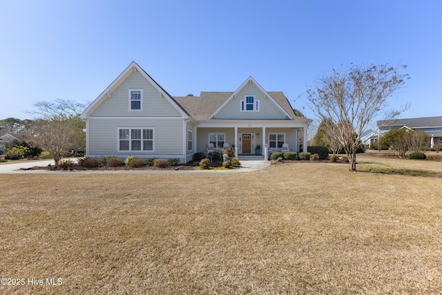 craftsman-style house featuring a front lawn and a porch