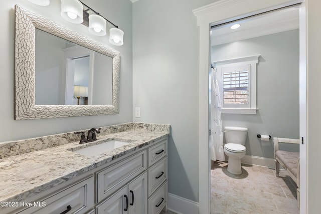 full bath featuring curtained shower, baseboards, toilet, and vanity