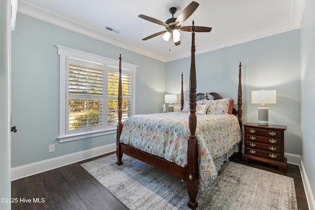 bedroom with visible vents, ceiling fan, baseboards, ornamental molding, and wood finished floors