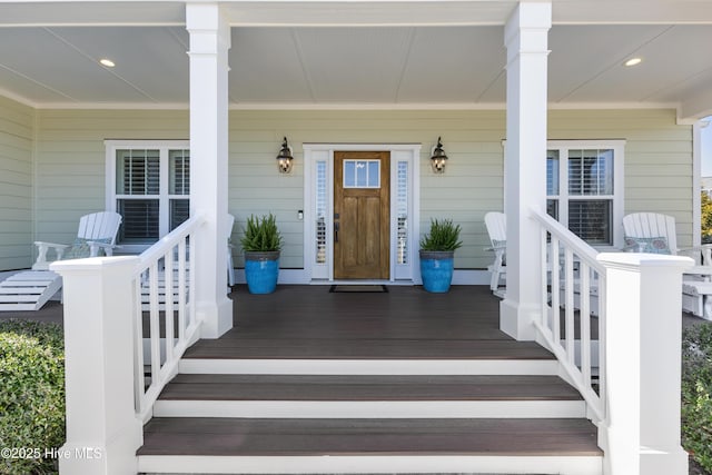 doorway to property featuring covered porch