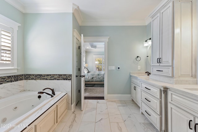 bathroom featuring vanity, baseboards, ornamental molding, a jetted tub, and marble finish floor