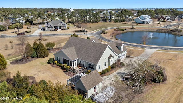 bird's eye view featuring a residential view and a water view