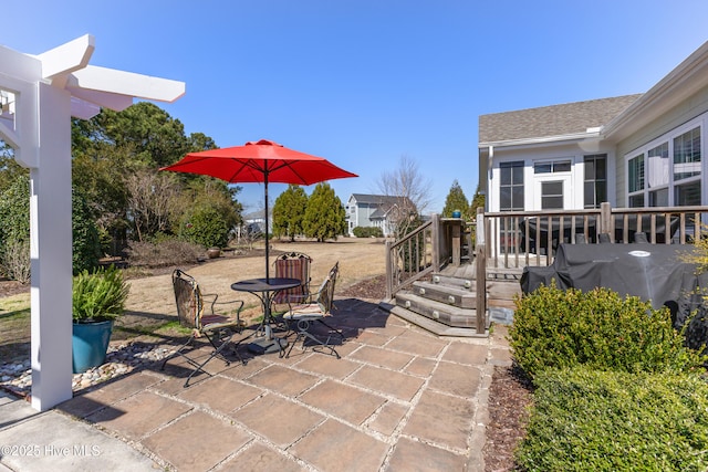 view of patio / terrace featuring outdoor dining area and a grill