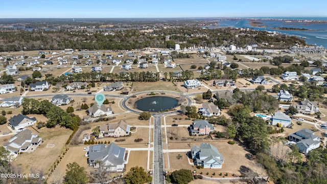 aerial view featuring a water view and a residential view