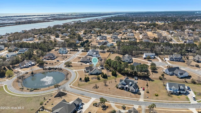 aerial view with a residential view and a water view