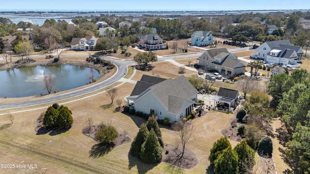 birds eye view of property with a residential view and a water view