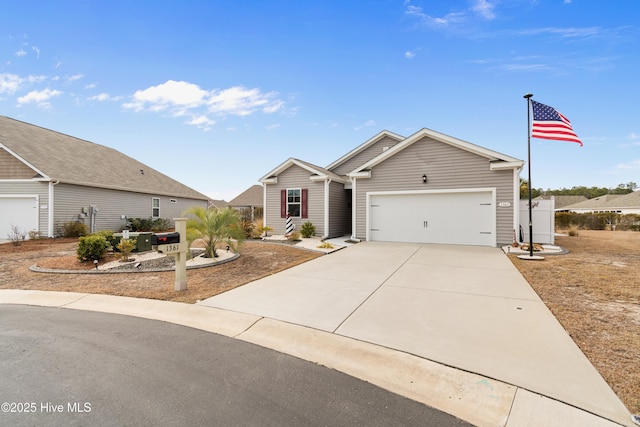 ranch-style house featuring driveway and an attached garage