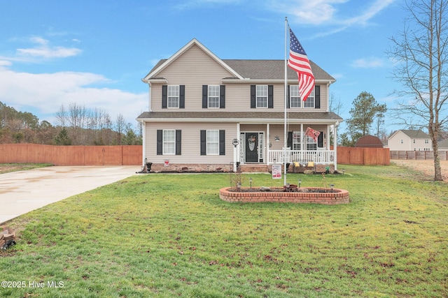 view of front of home featuring a porch, concrete driveway, a front yard, and fence