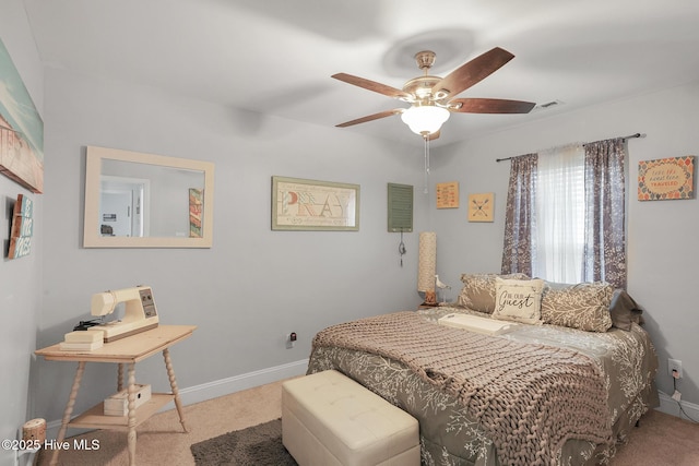 bedroom with baseboards, carpet floors, visible vents, and a ceiling fan