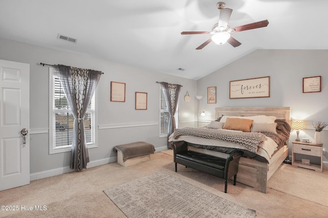 carpeted bedroom featuring visible vents, lofted ceiling, multiple windows, and baseboards