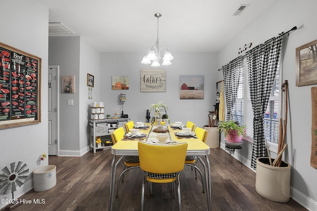 dining room featuring visible vents, baseboards, an inviting chandelier, and dark wood finished floors