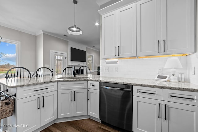 kitchen featuring crown molding, backsplash, dishwasher, and a peninsula