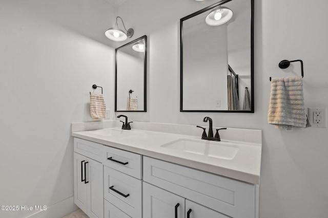 full bath with double vanity and a sink