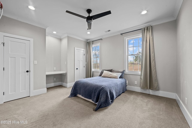 bedroom with baseboards, carpet, visible vents, and crown molding