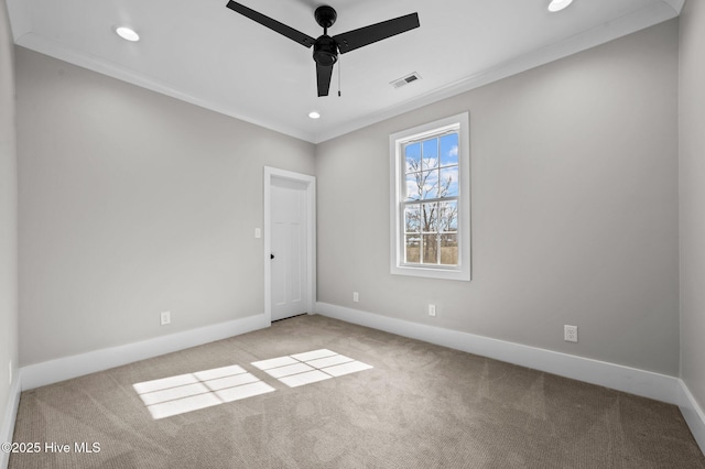 unfurnished bedroom featuring baseboards, carpet, visible vents, and crown molding