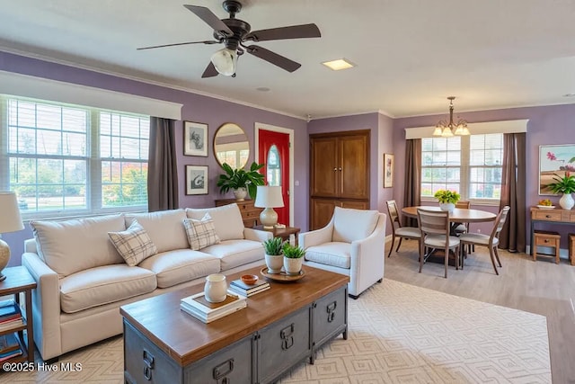 13596 Hobbton Hwy, Newton Grove, NC 28366 - living room featuring a chandelier, crown molding, light wood-style flooring, and ceiling fan