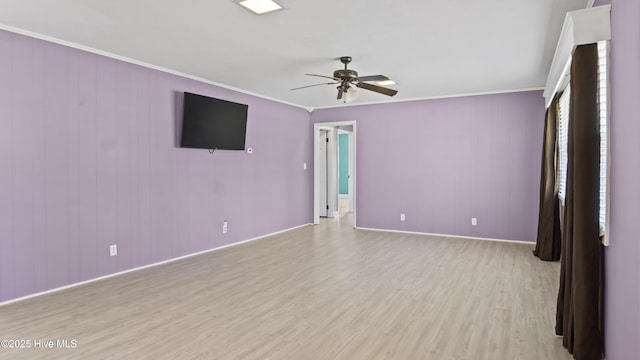 13596 Hobbton Hwy, Newton Grove, NC 28366 - spare room featuring light wood-style floors, a ceiling fan, crown molding, and baseboards
