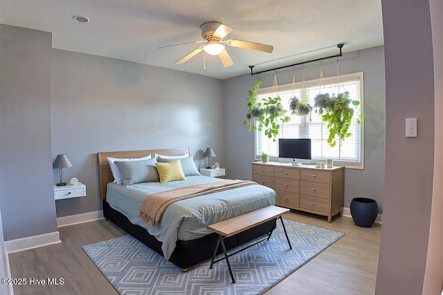 13596 Hobbton Hwy, Newton Grove, NC 28366 - bedroom featuring light wood-style floors, baseboards, and ceiling fan