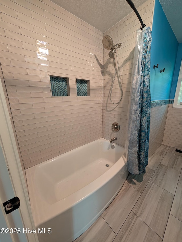 13596 Hobbton Hwy, Newton Grove, NC 28366 - full bathroom featuring tiled shower / bath and a textured ceiling