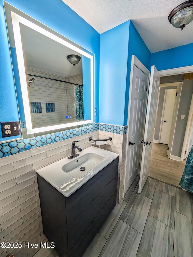 13596 Hobbton Hwy, Newton Grove, NC 28366 - bathroom with tile walls, vanity, and curtained shower