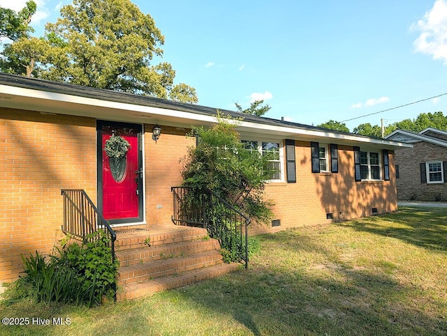 13596 Hobbton Hwy, Newton Grove, NC 28366 - view of front facade featuring crawl space, a front yard, and brick siding