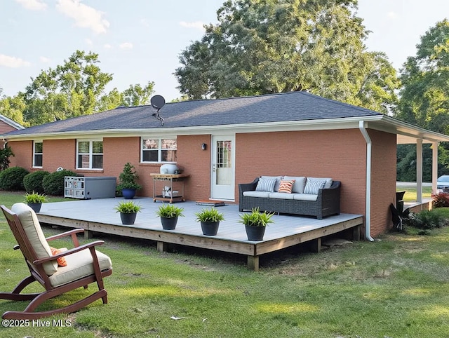 13596 Hobbton Hwy, Newton Grove, NC 28366 - rear view of property with a lawn, a deck, brick siding, and outdoor lounge area