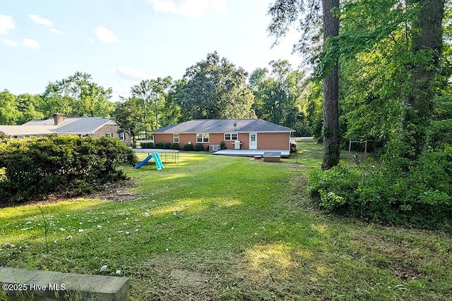13596 Hobbton Hwy, Newton Grove, NC 28366 - view of grassy yard with a wooden deck
