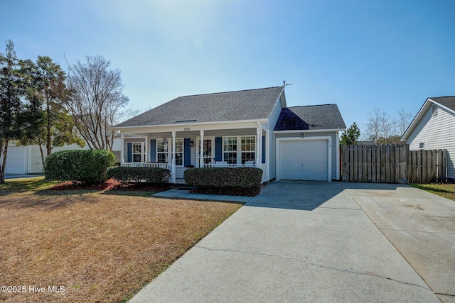 view of front of house with a front lawn, a porch, fence, concrete driveway, and an attached garage