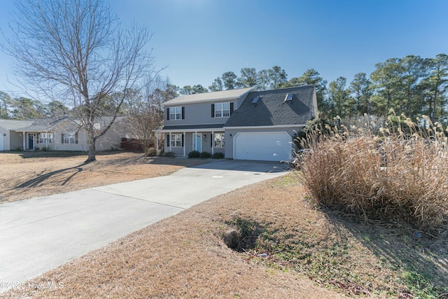 view of front facade featuring an attached garage, a shingled roof, and concrete driveway