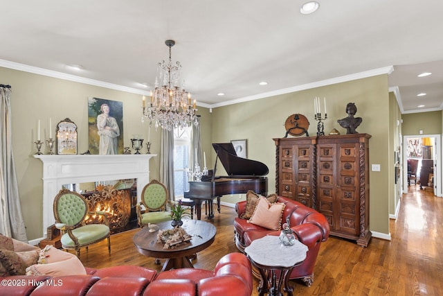 living room with baseboards, wood finished floors, a high end fireplace, and ornamental molding