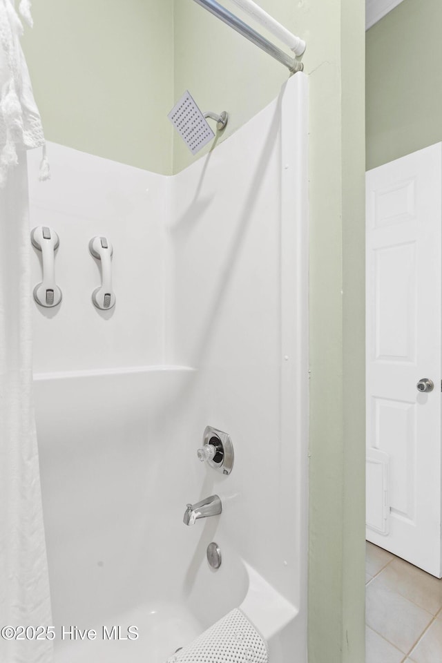 full bathroom featuring shower / tub combo and tile patterned flooring